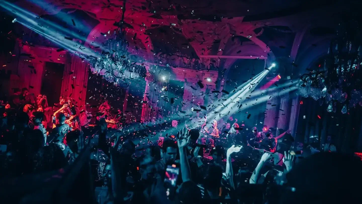 Confetti and dancing at Café Opera nightclub in Stockholm with colorful lights