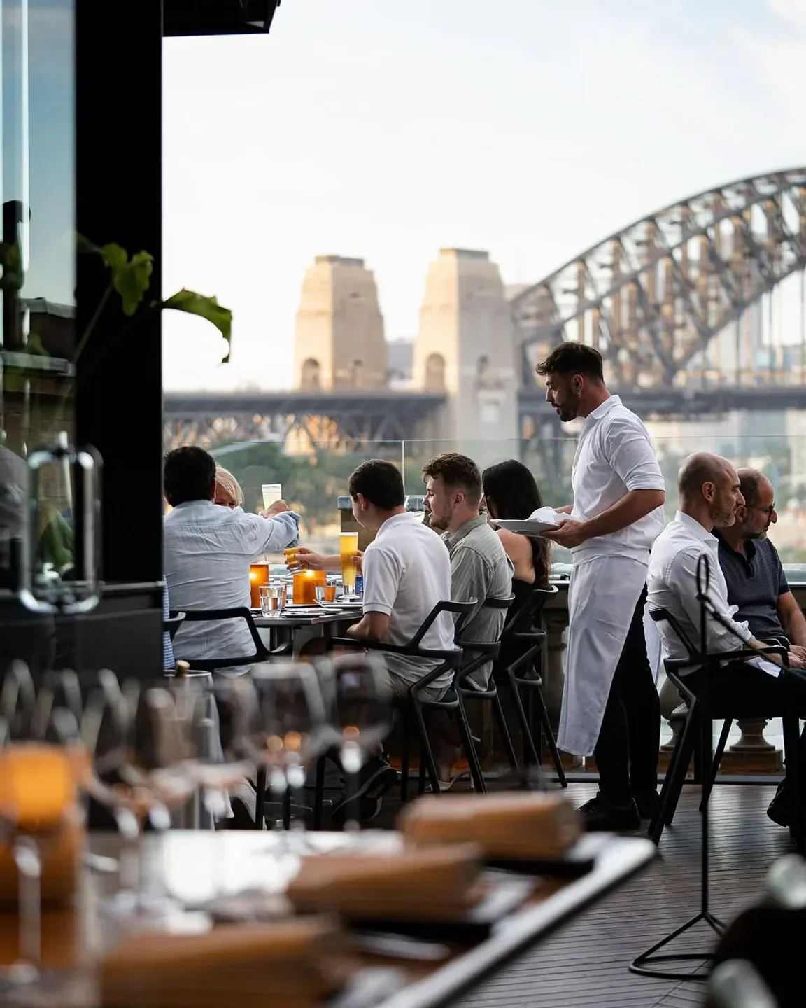 Cafe Sydney diners enjoying food and drinks with Sydney Harbour Bridge views