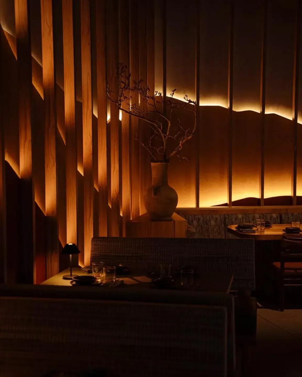 Cozy interior at Callao restaurant in Sydney, featuring wooden accents and dim lighting.