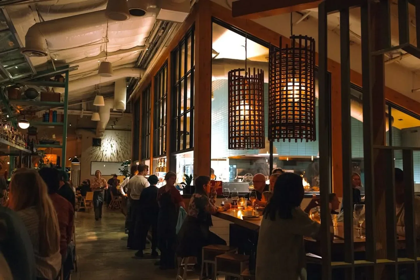Interior of Campfire restaurant in San Diego, with warm lighting and diners.