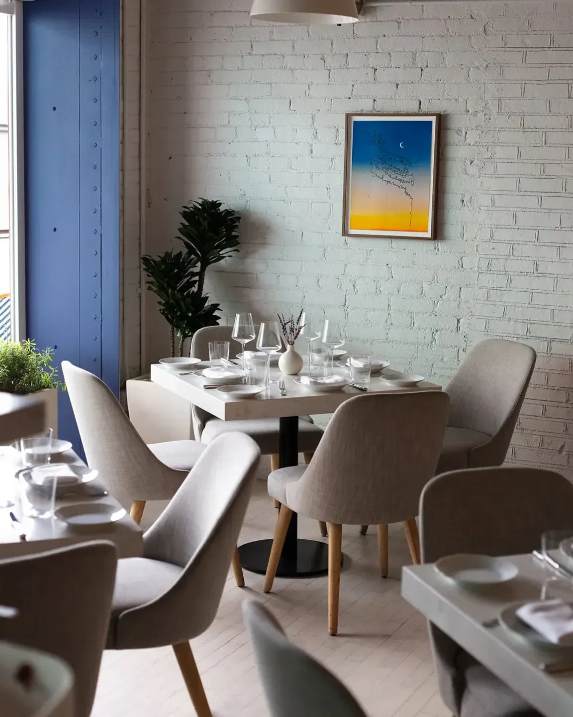 Interior dining at Camphor restaurant in Los Angeles, featuring a modern, minimalist design.