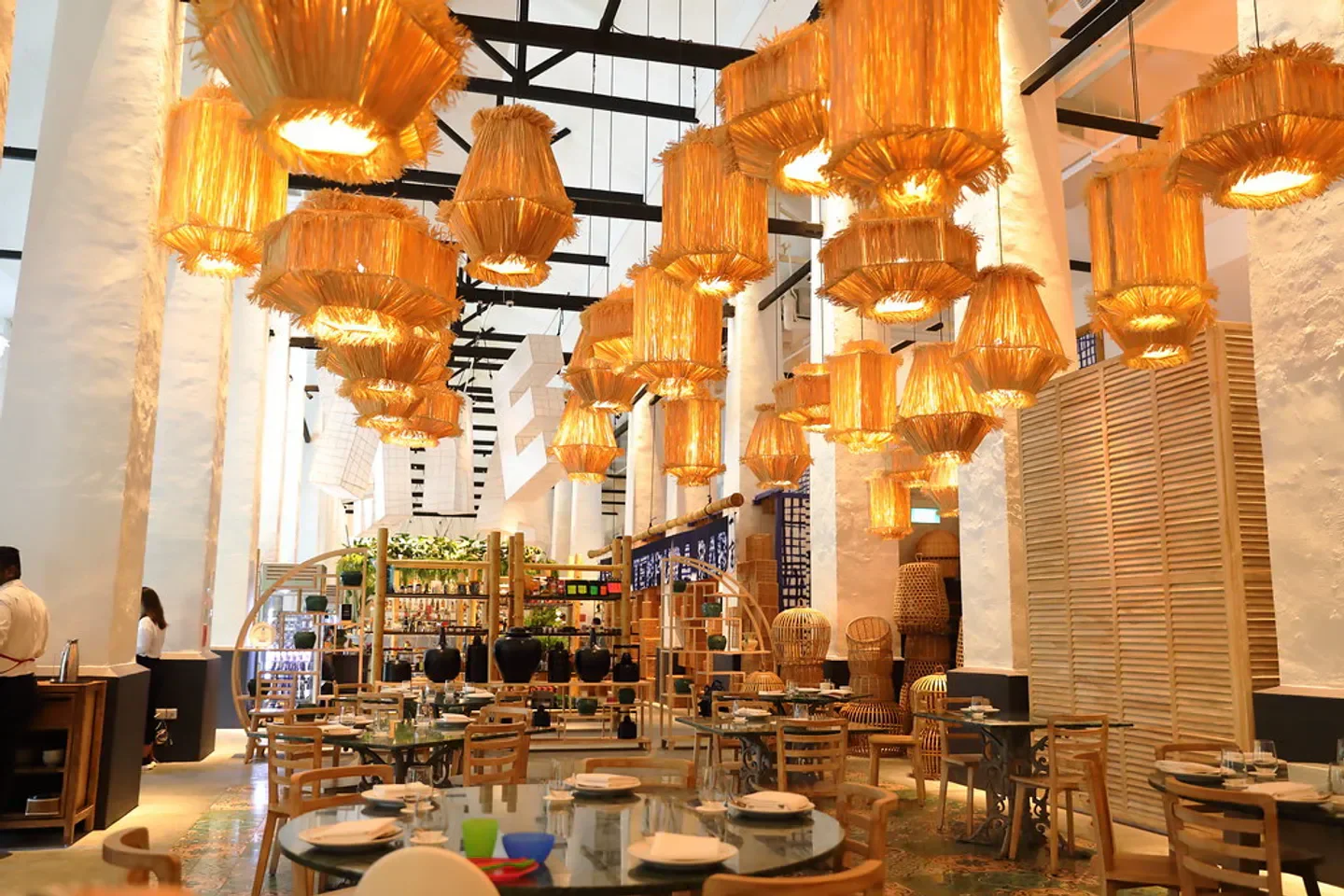Candlenut restaurant in Singapore with unique decor and warm lighting. Tables set and ready.