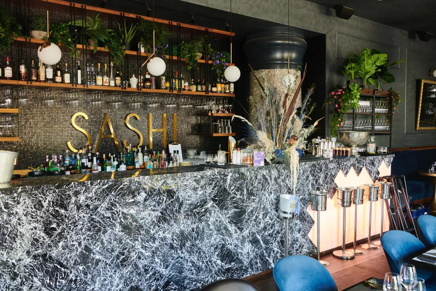 Stylish bar at CAPA restaurant in Copenhagen, featuring a marble countertop and elegant decor.
