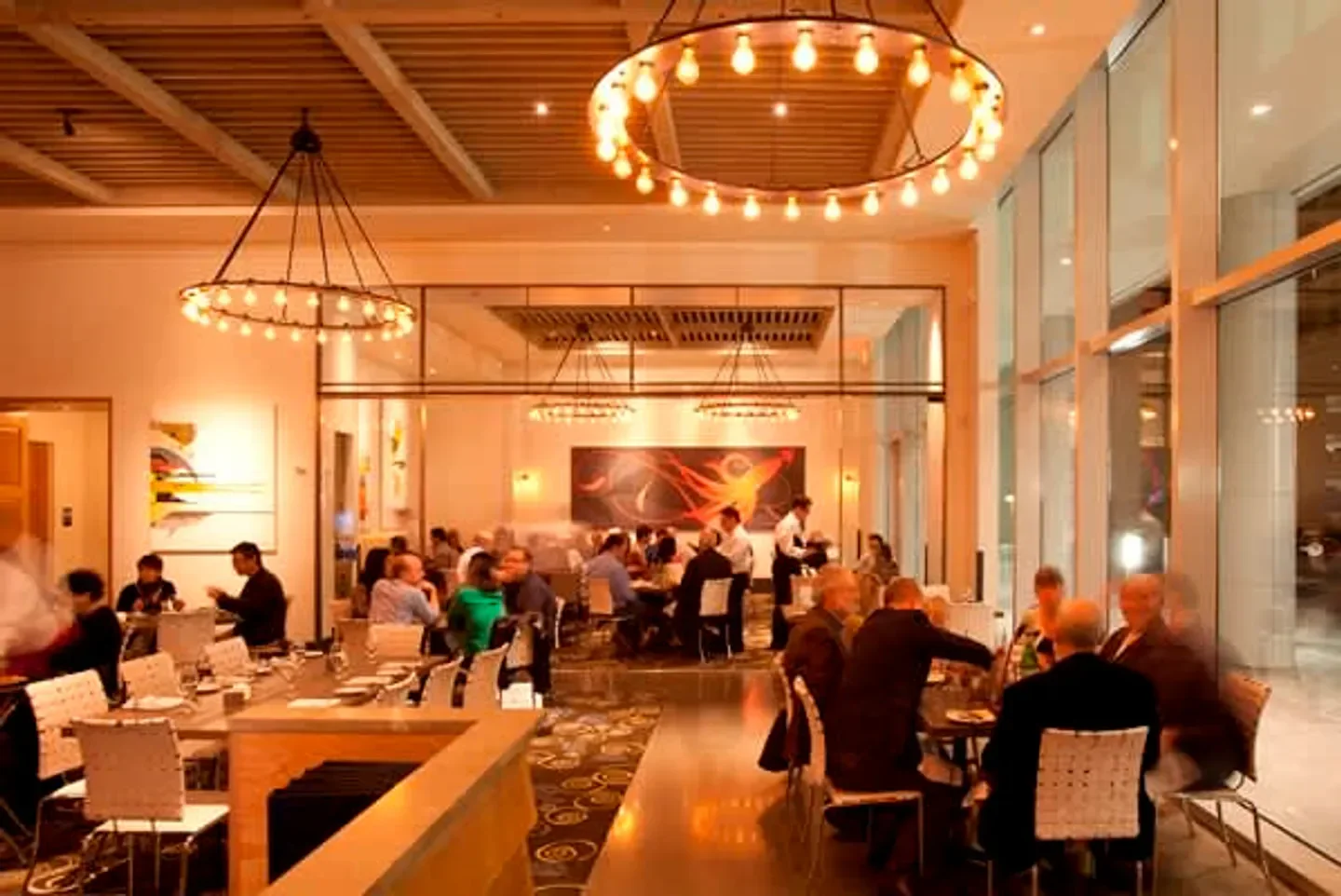 Elegant dining area at Caracol restaurant in Houston, with stylish chandeliers and ambiance.