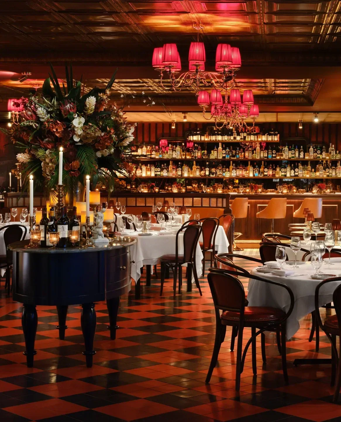 Elegant interior of Carbone Dallas restaurant featuring beautiful lighting and ambiance.