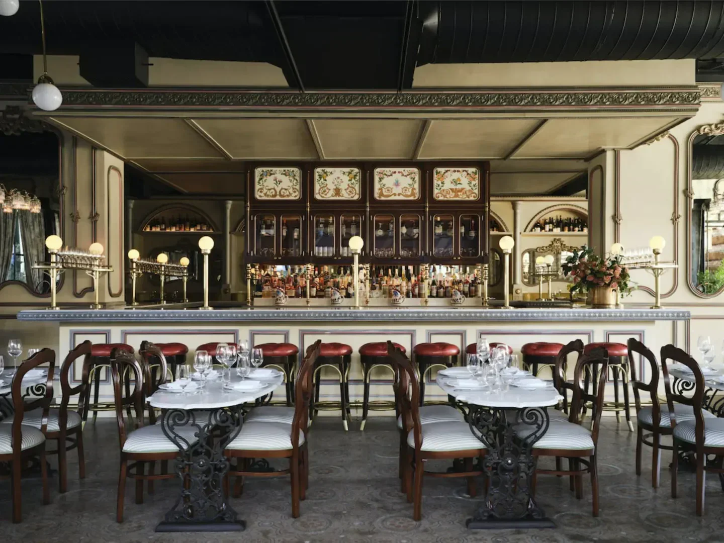 Elegant dining room interior at Carbone Vino in Dallas, with bar and seating.