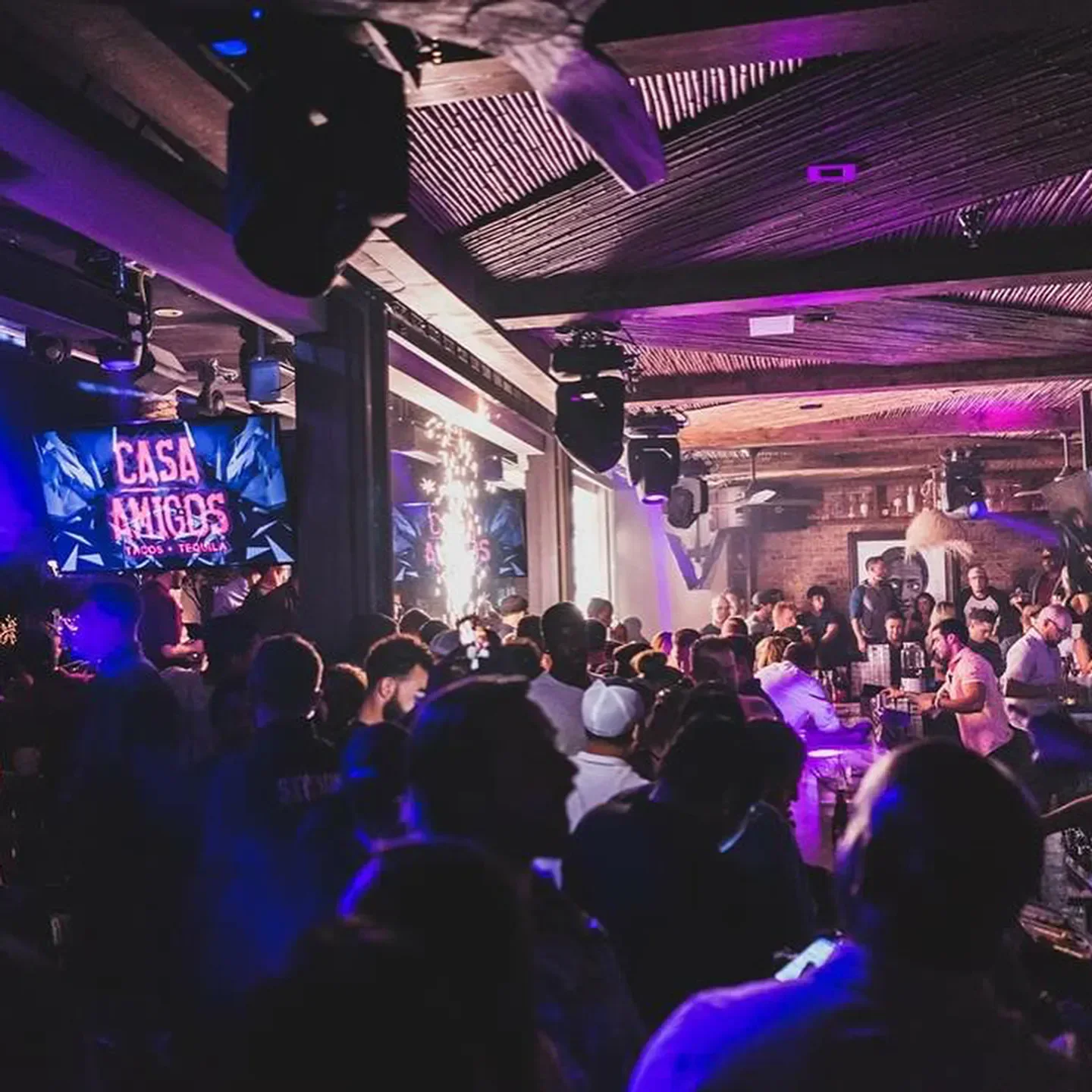 Casa Amigos nightclub in Scottsdale, packed with people and vibrant lighting at night.