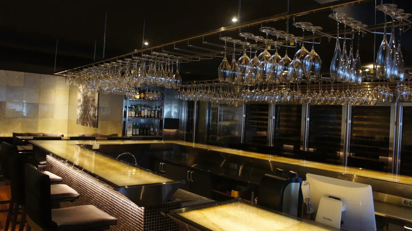 Casa del Vino in Seoul: stylish bar with hanging glasses and a welcoming atmosphere.