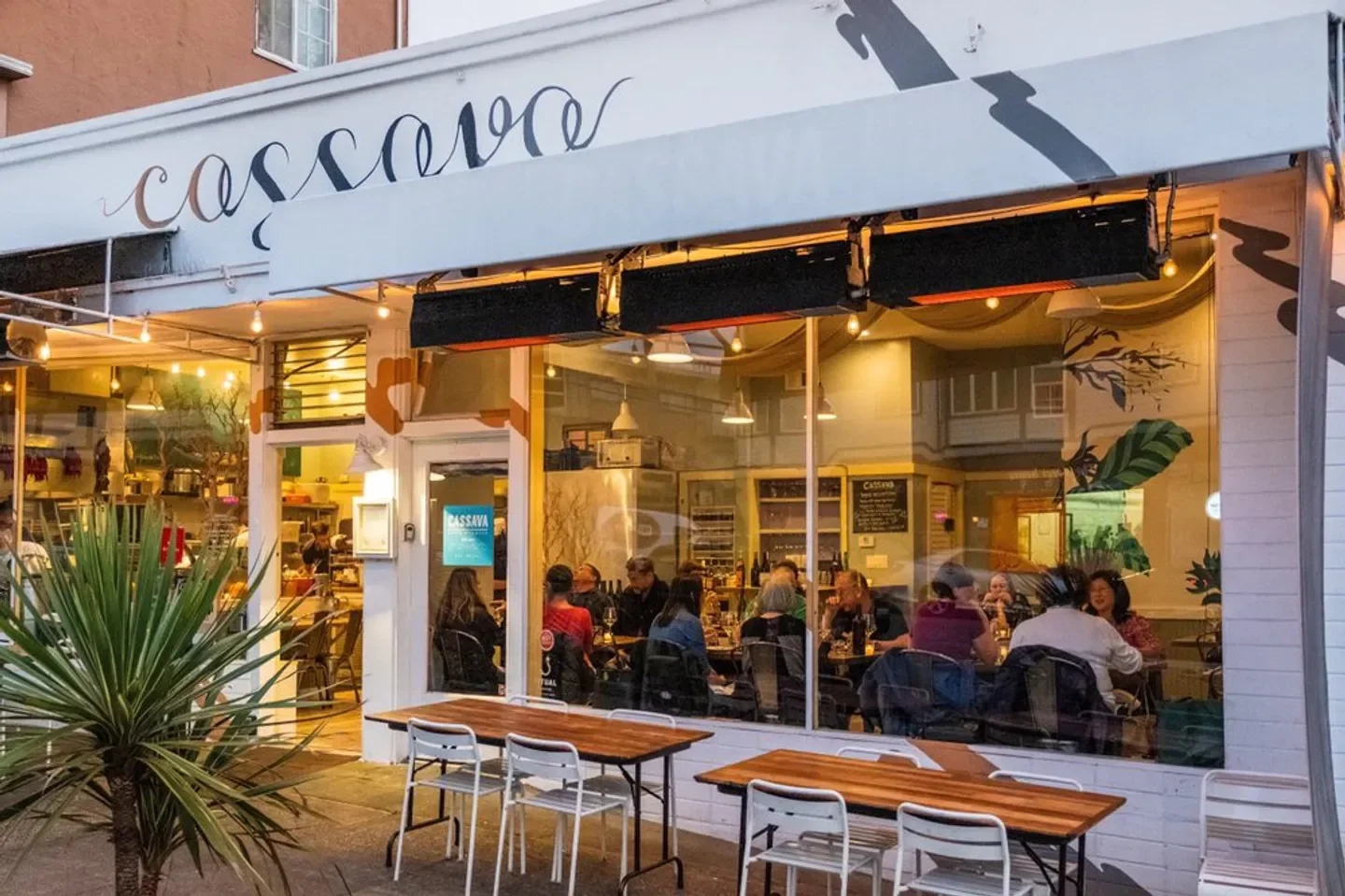 Exterior of Cassava restaurant in San Francisco with patrons dining inside.