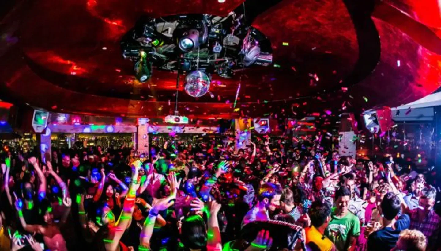 Energetic party at Ce La Vi nightclub in Hong Kong with confetti and people dancing.