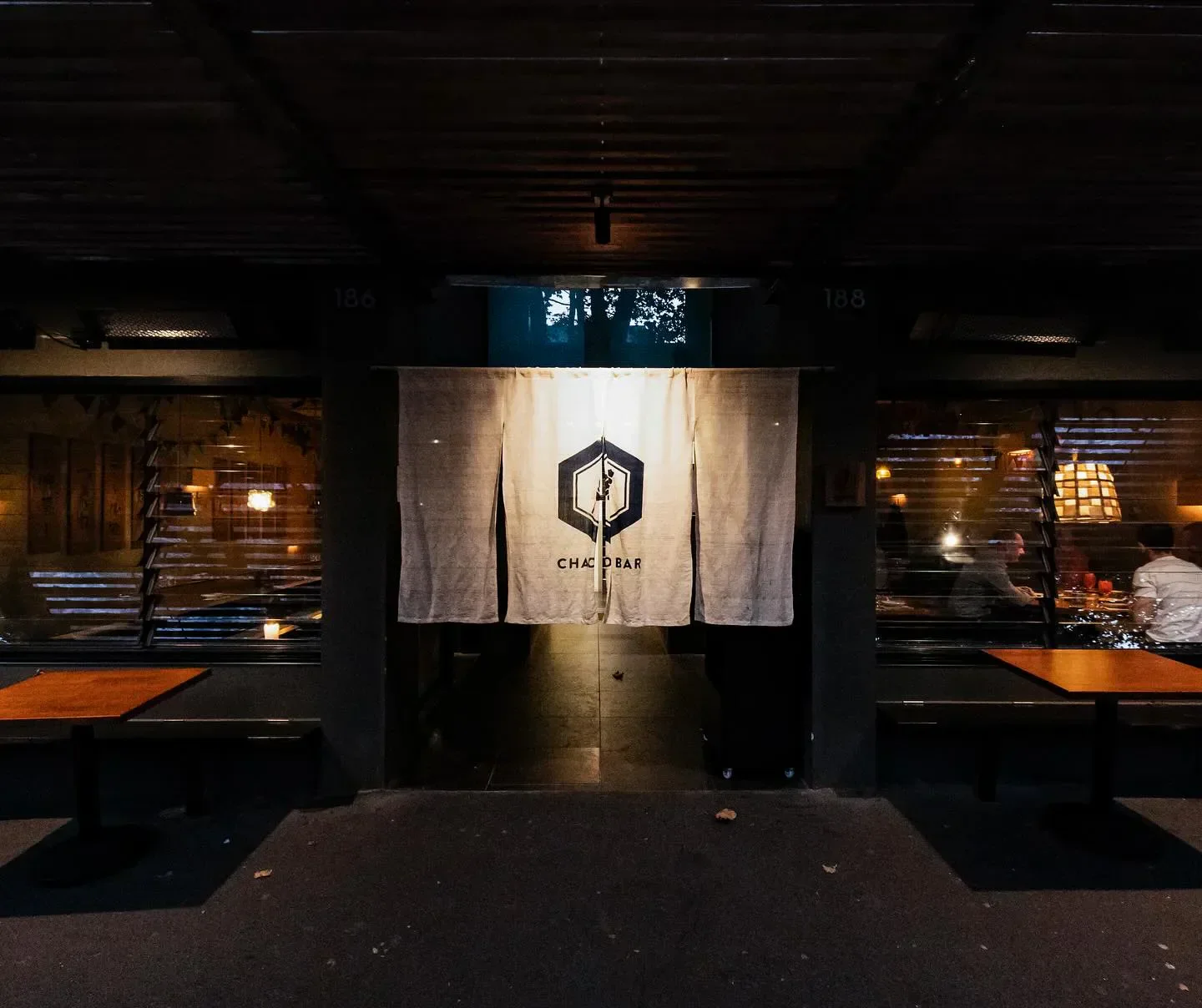 Entrance of Chaco Bar restaurant in Sydney, featuring the venue's name on a curtain.