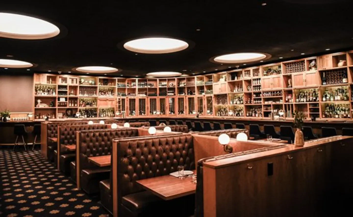Cozy booths and bar at Cherry Circle Room restaurant in Chicago