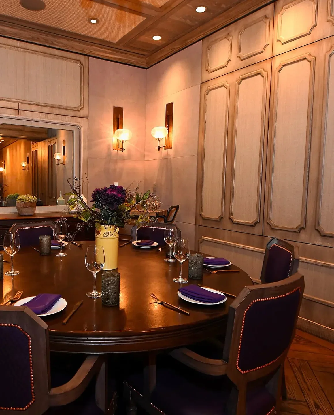 Chica restaurant in Las Vegas, elegant dining room with round table set for guests.