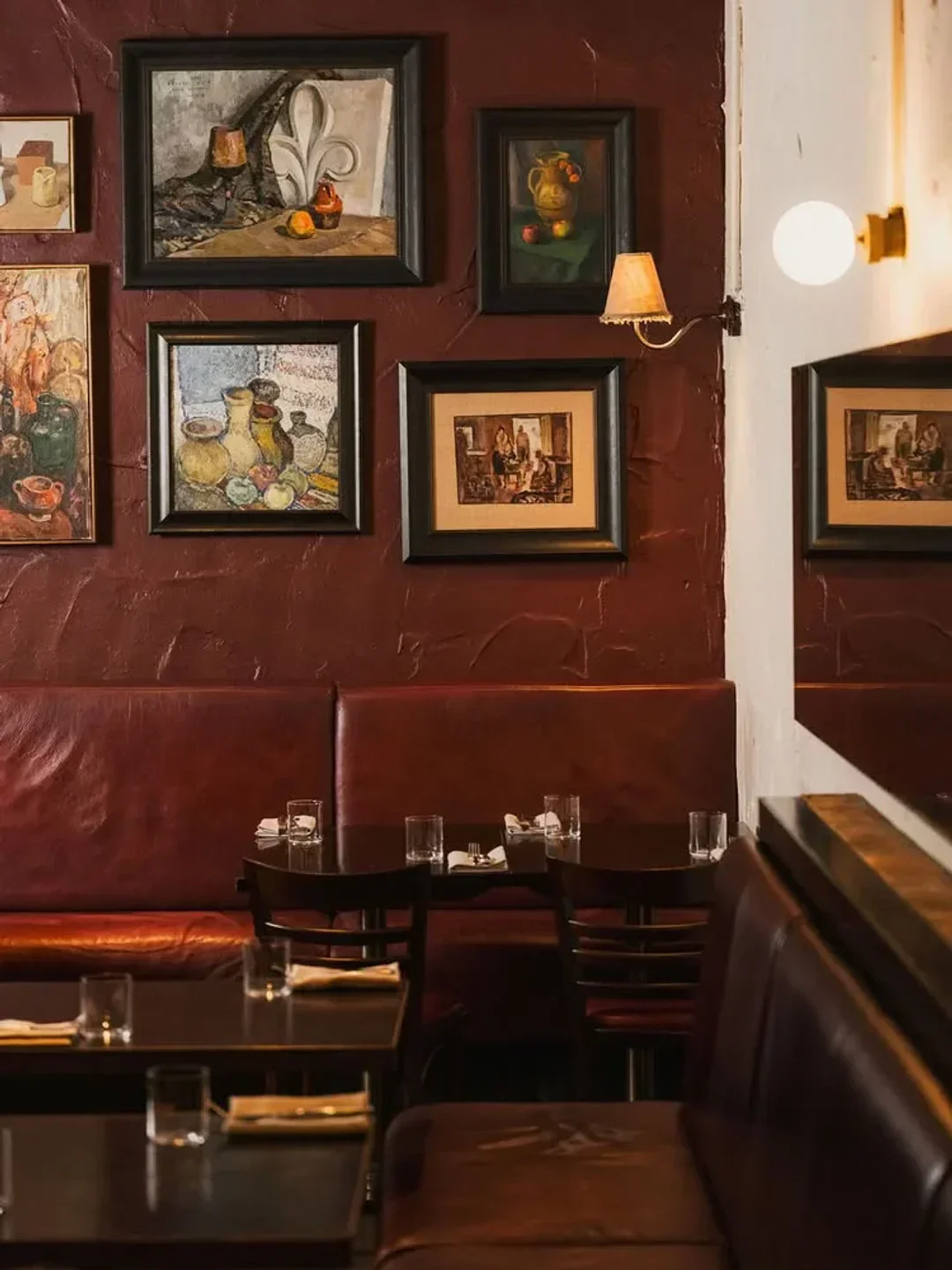 Elegant dining area at Chophouse Sydney, featuring artwork and cozy booth seating in Sydney.
