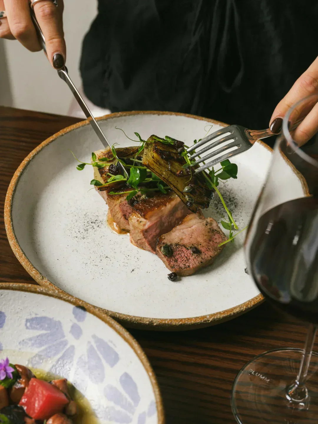 Delicious steak dish being cut at Civico 47 restaurant in Sydney, ready to be enjoyed.