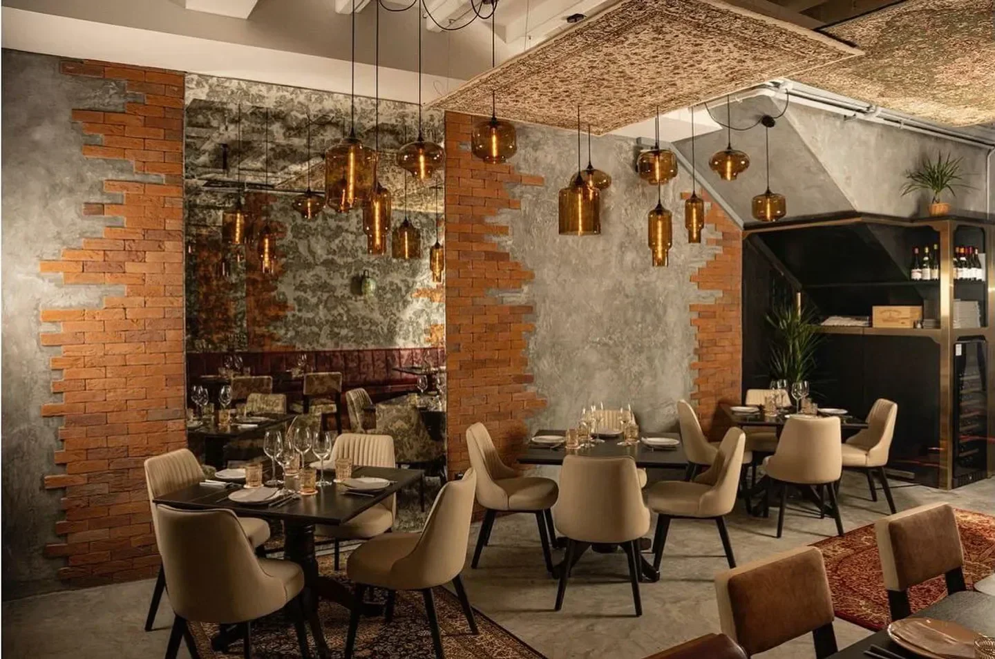 Elegant dining interior at Clos Pasoh restaurant in Singapore with stylish lighting