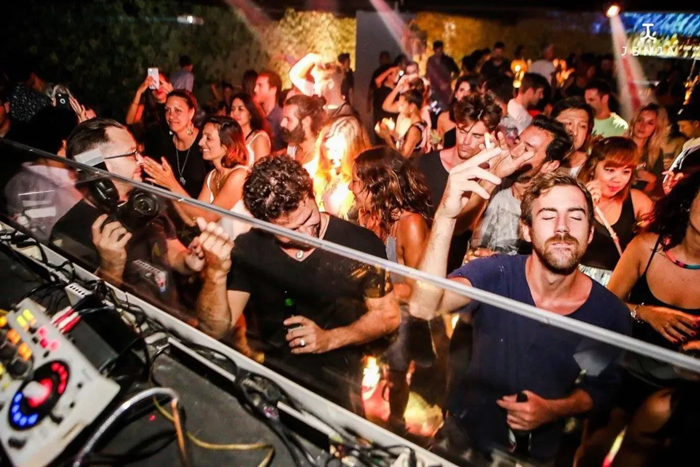 Energetic crowd enjoying the music at Club Jenja in Bali, a popular nightclub destination.