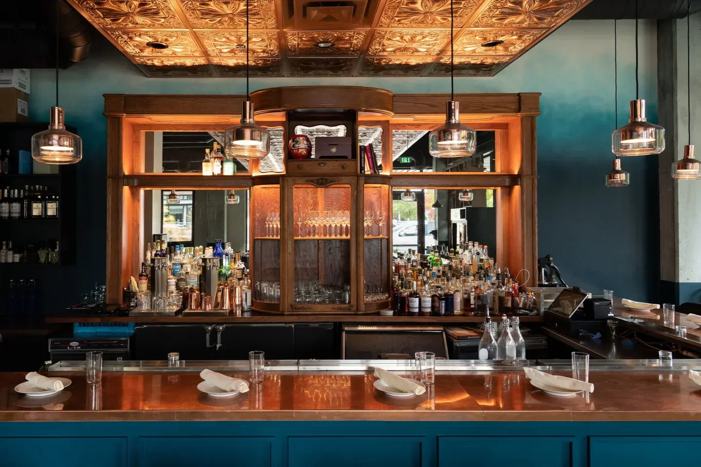 Interior bar at COMMUNION Restaurant & Bar in Seattle, featuring a copper bar top.