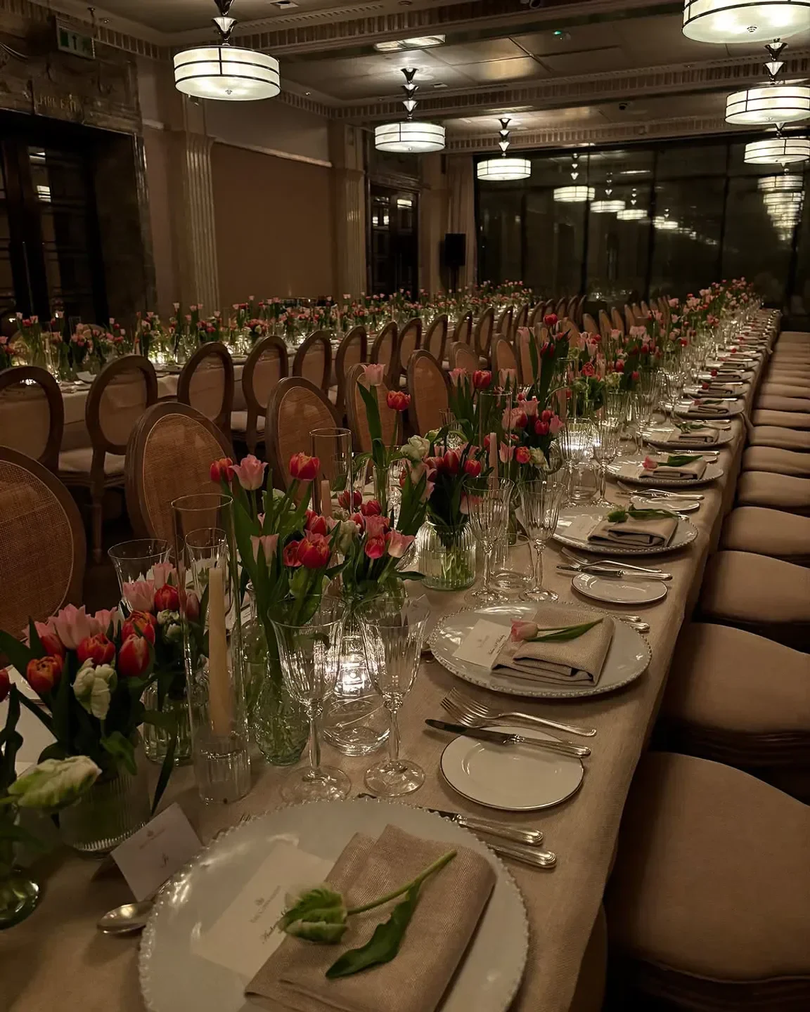 Elegant dining at Connaught Restaurant in London with floral arrangements and table settings.