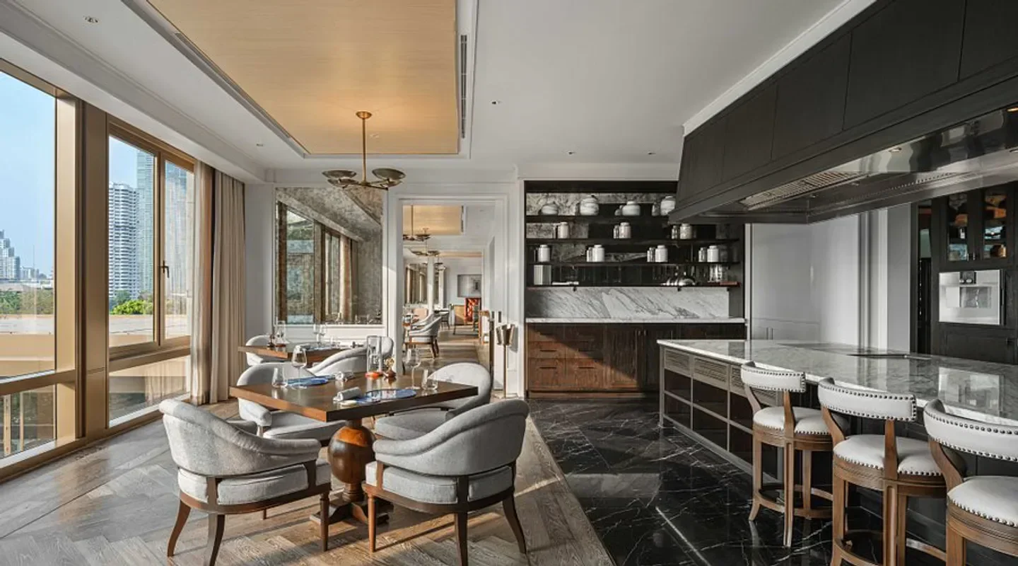 Elegant interior of Côte by Mauro Colagreco restaurant in Bangkok with city views.