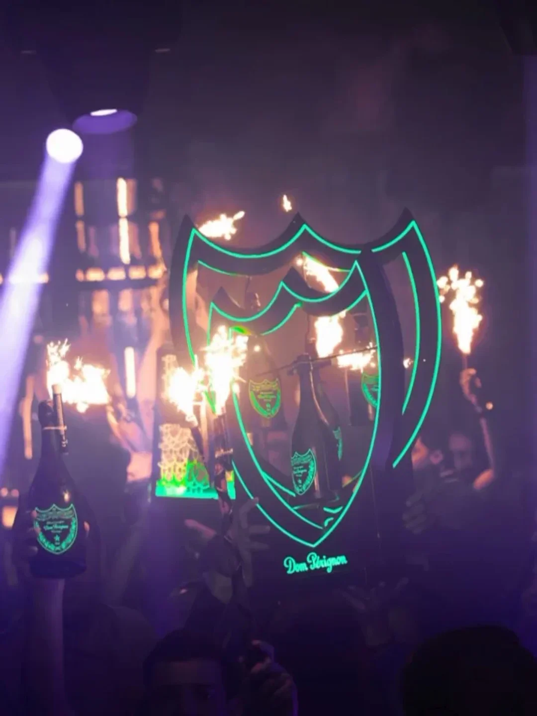 COYA Club Marbella nightlife with champagne bottles and sparklers, celebrating with Dom Perignon.