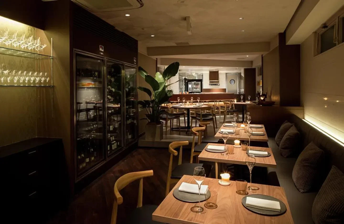 Elegant dining area at Crony restaurant in Tokyo, showcasing a warm and inviting atmosphere.