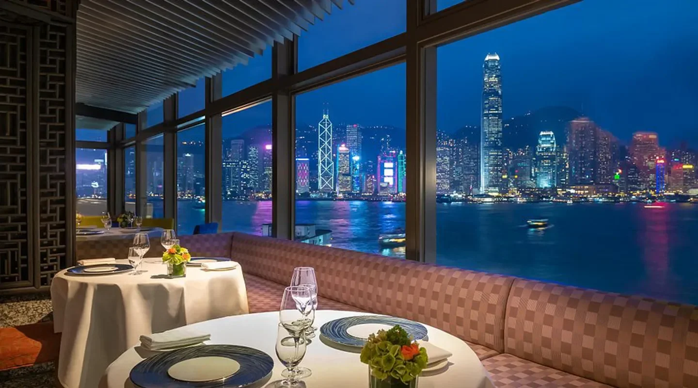 Cucina Hong Kong restaurant with waterfront views of the city at night