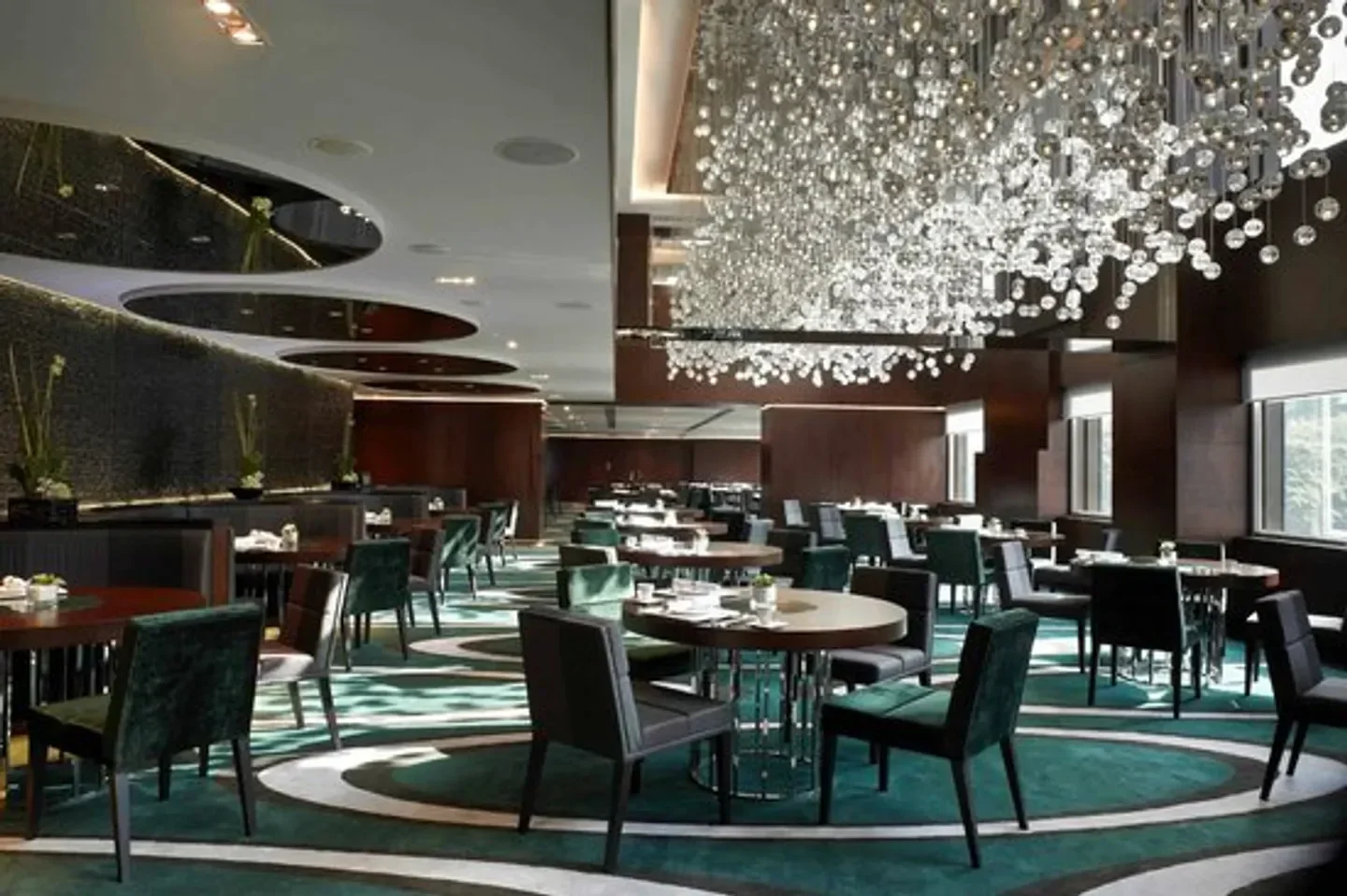 Interior of Cuisine Cuisine at The Mira in Hong Kong, featuring elegant dining room.