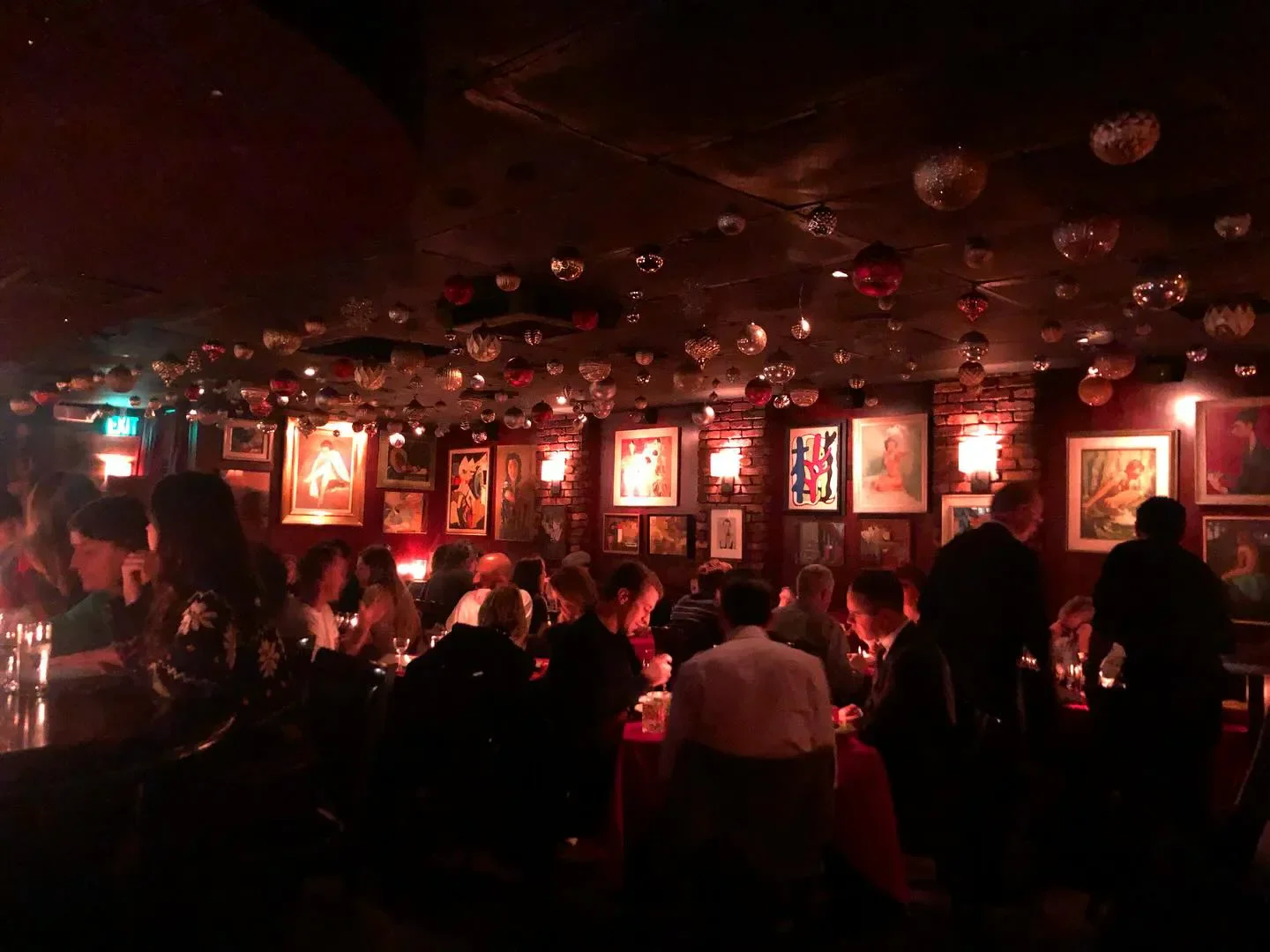 Cozy dining room at Dear John's in Los Angeles, featuring art and ambiance.