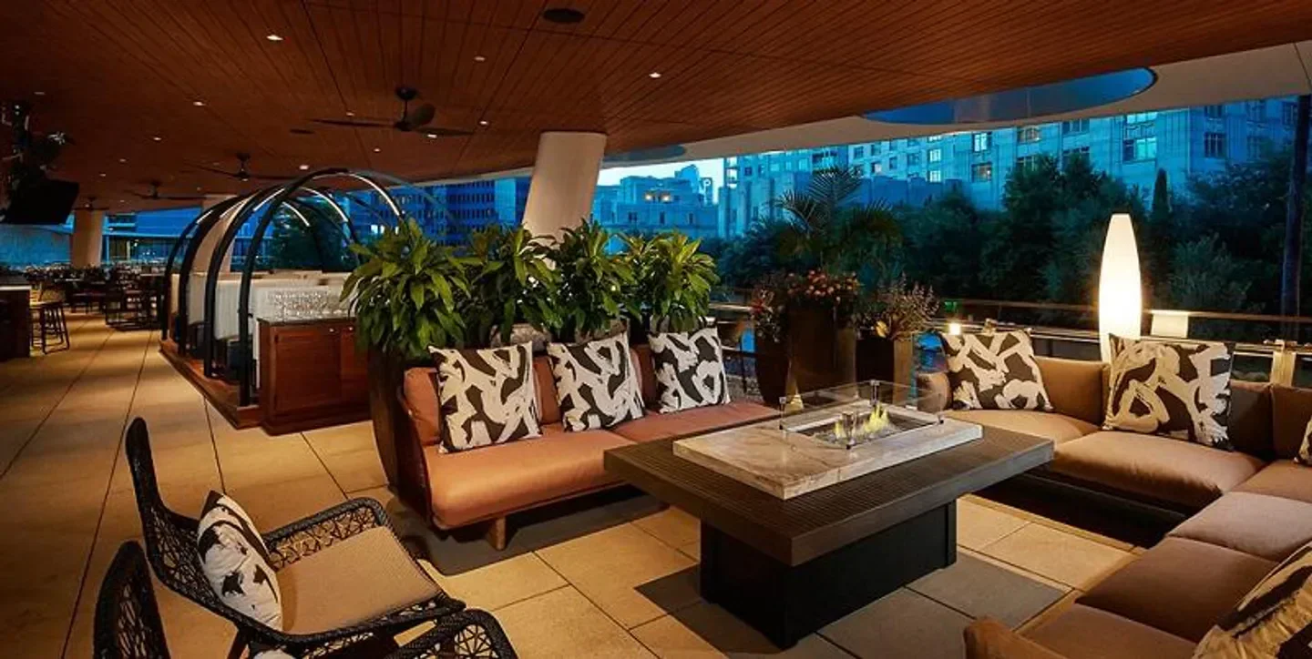 Outdoor seating at Del Frisco's Double Eagle Steakhouse - Dallas, in Dallas, with city views.