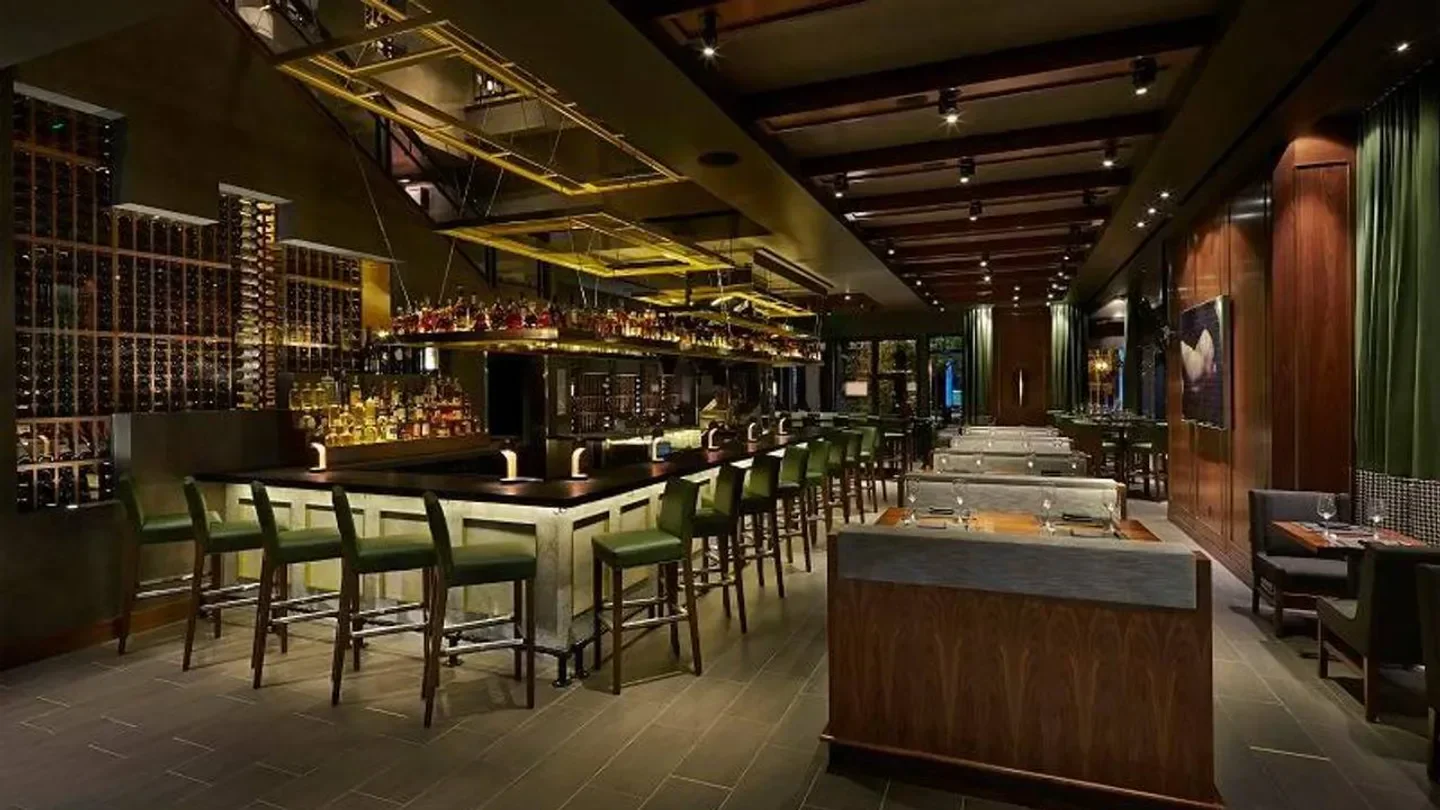 Interior of Del Frisco's Double Eagle Steakhouse in Washington, featuring bar seating and wine display