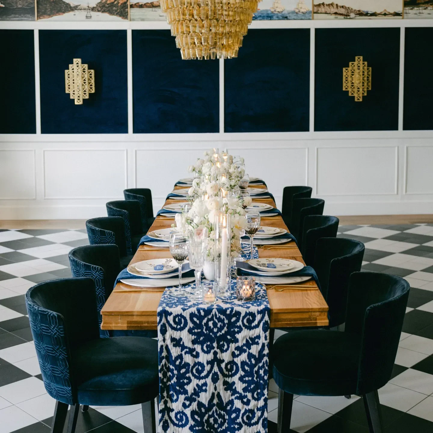 Elegant dining at Del Mar restaurant in Washington, featuring stylish decor and floral centerpiece.