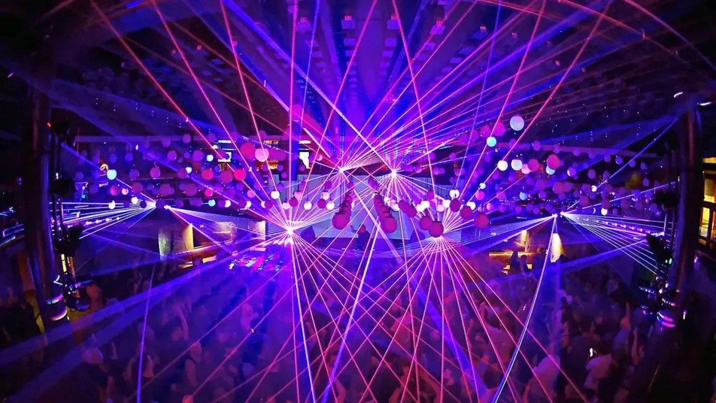 Laser lights illuminate the dance floor at District nightclub in Atlanta.