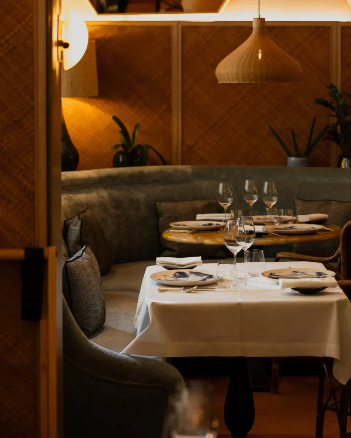Cozy dining area at Divellec restaurant in Paris, featuring elegant table setting.