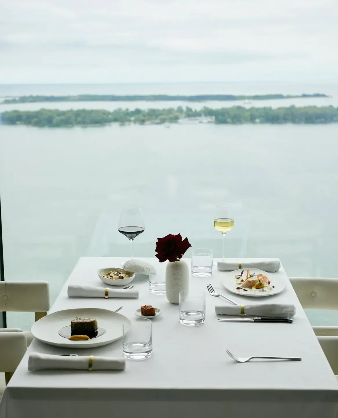 Elegant dining table at Don Alfonso 1890 Toronto, overlooking the Toronto waterfront.