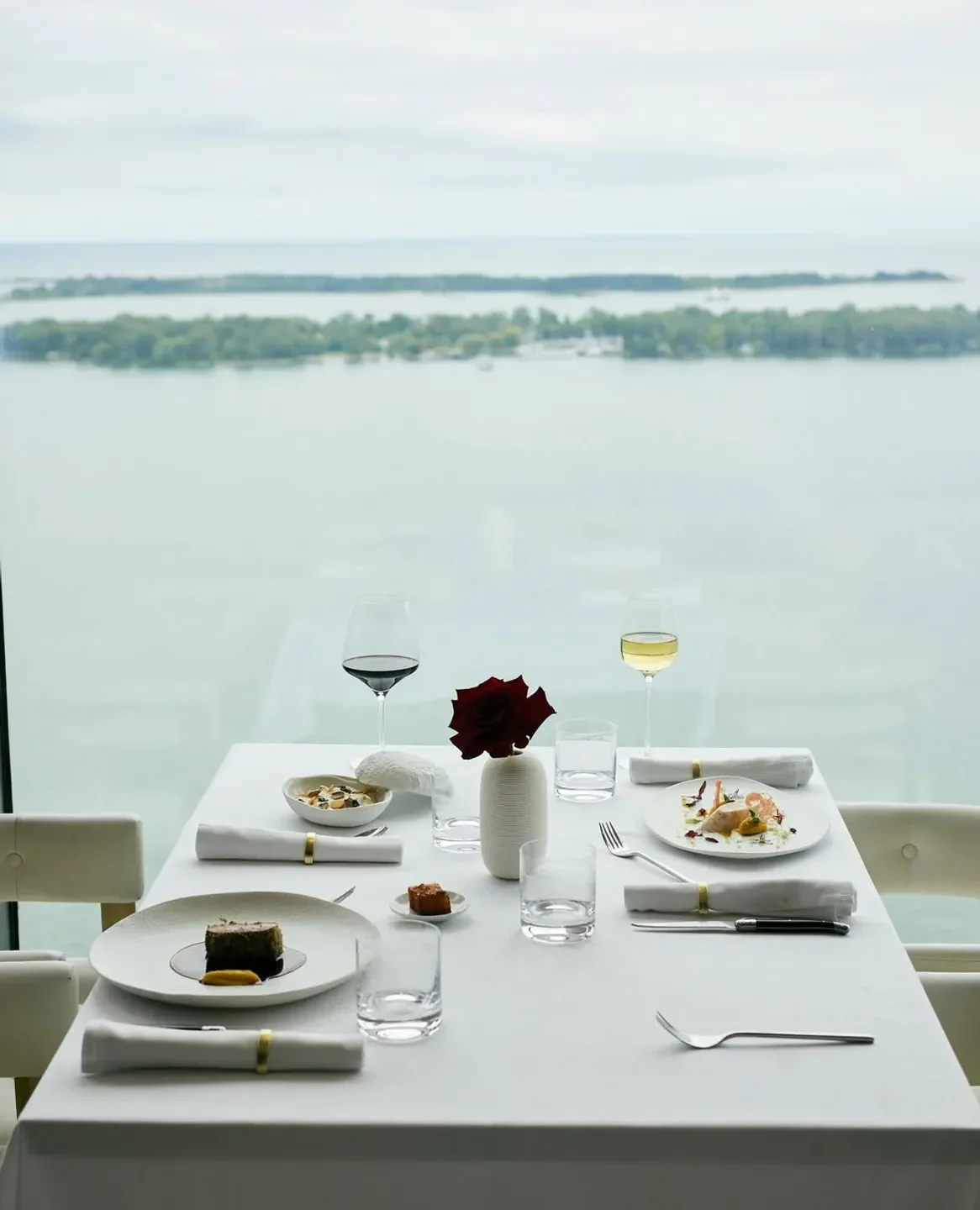 Elegant dining table at Don Alfonso 1890 Toronto, overlooking the Toronto waterfront.