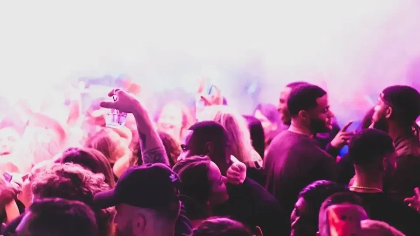 Energetic crowd at Down nightclub in Boston, enjoying the party and drinks