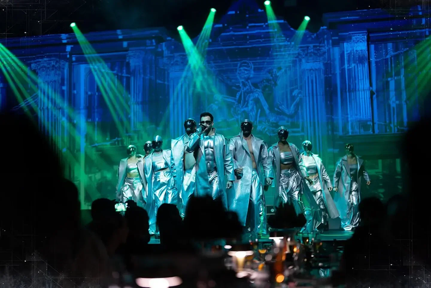 Futuristic performance at DREAM nightclub in Dubai with performers in silver attire.