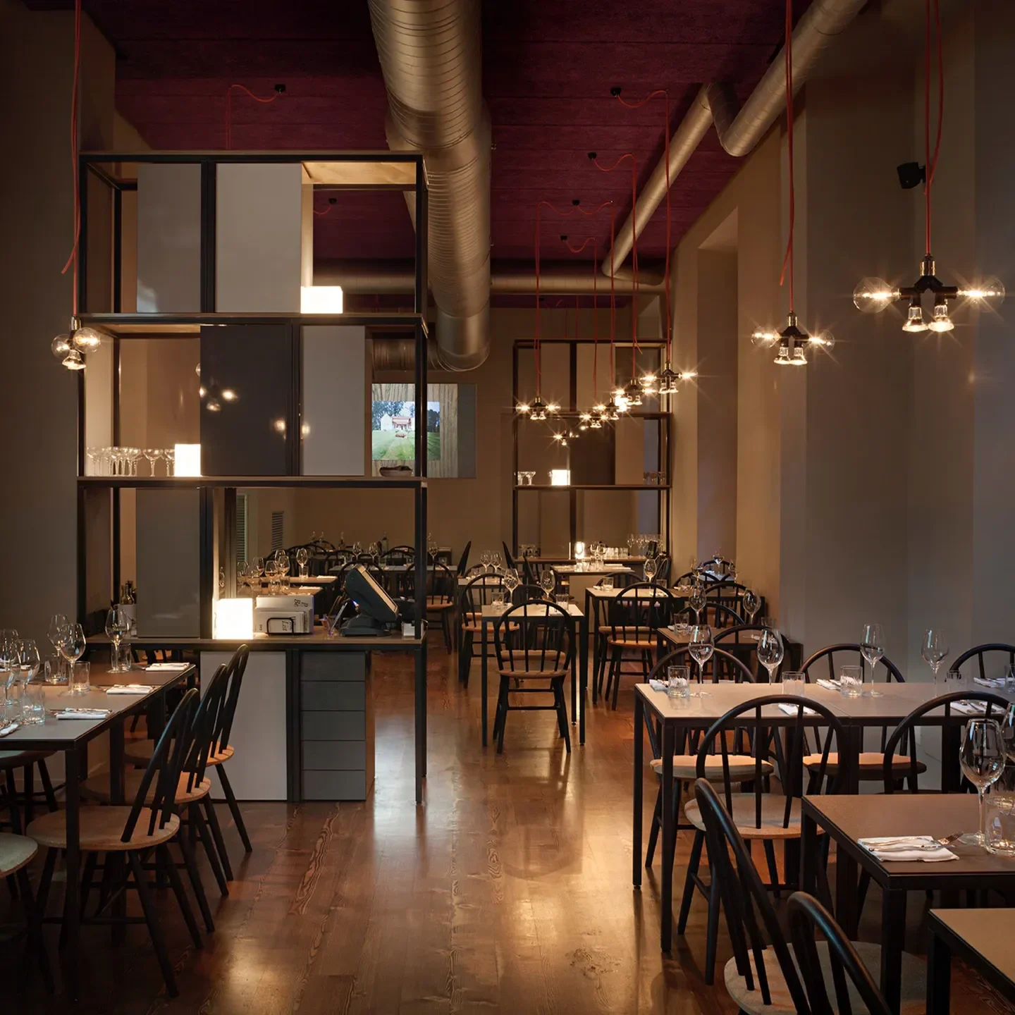Interior view of DRY restaurant in Milan, showcasing modern decor and stylish lighting.