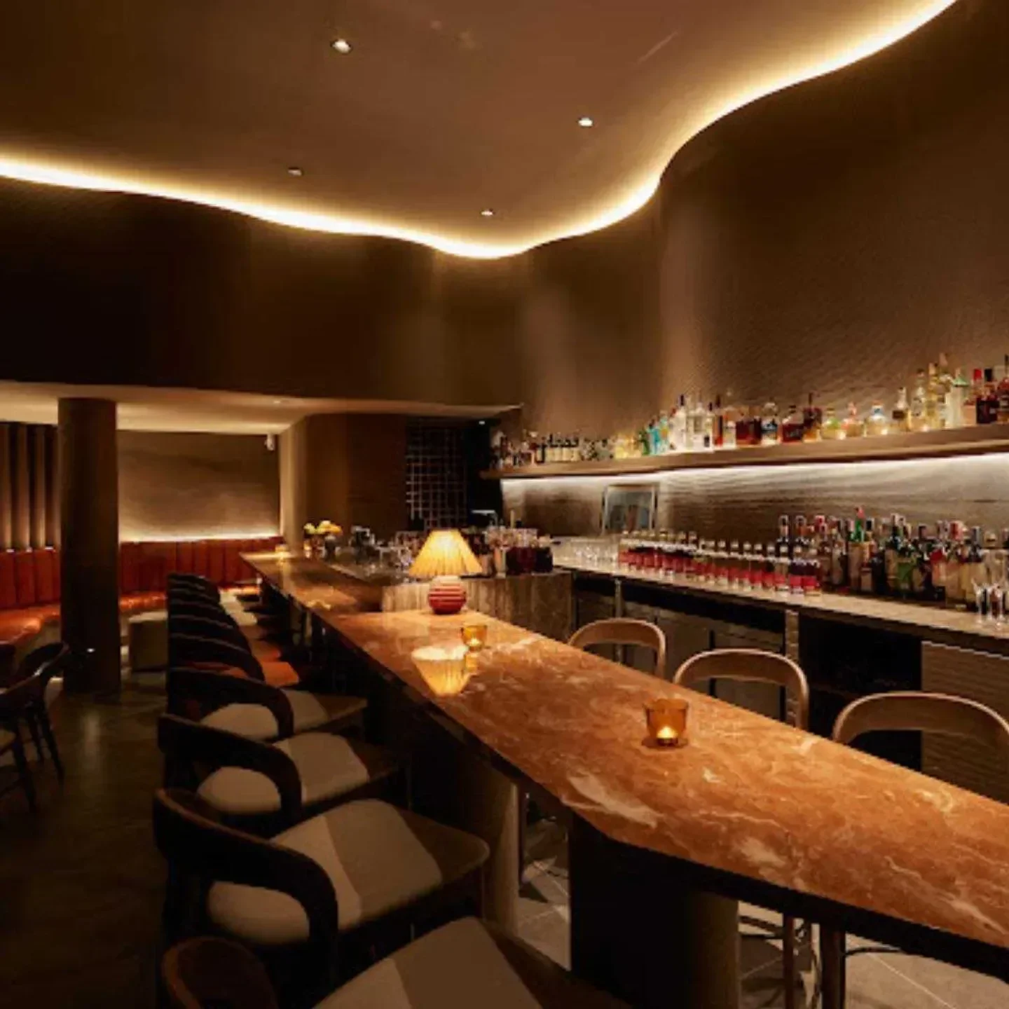 Interior of Dry Wave Cocktail Studio in Bangkok, featuring a stylish bar and seating.