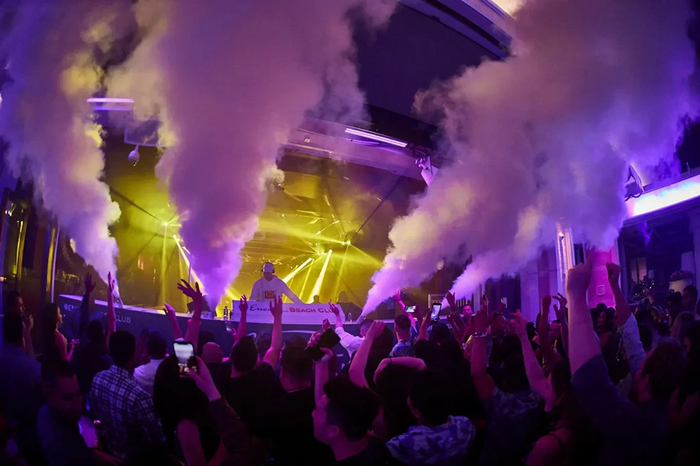 EBC at Night in Las Vegas: energetic nightclub scene with DJ and party crowd.