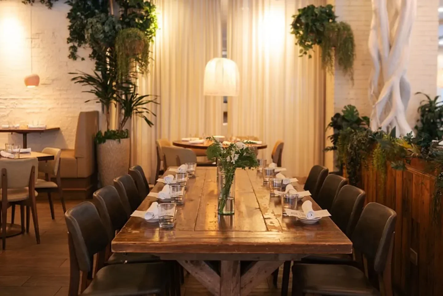Ema restaurant in Chicago: a beautifully set table in a stylish dining room.