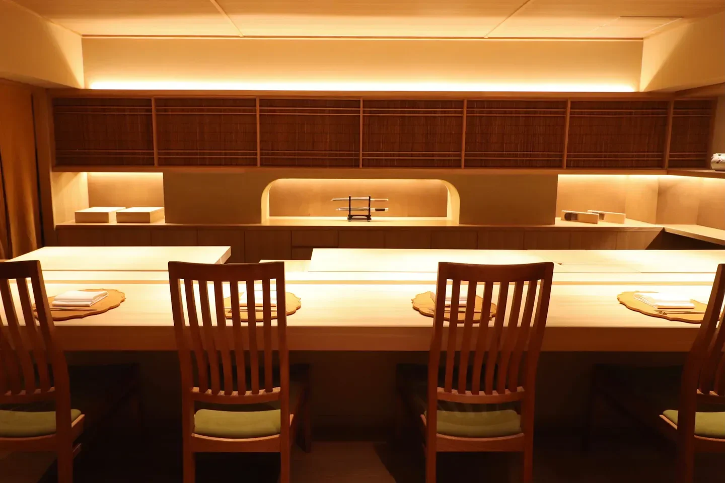 Elegant dining space at Ensui restaurant in Tokyo, showcasing minimalist design and wooden chairs