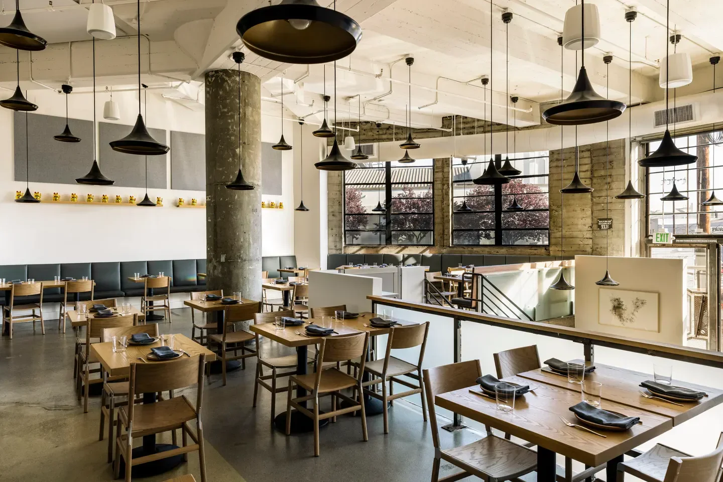 Interior of Ernest restaurant in San Francisco, with stylish lighting and tables.