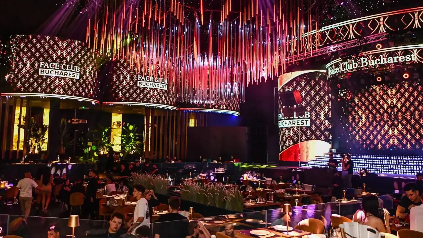 Inside Face Club Bucharest, a stylish nightclub in Bucharest with vibrant lights and decor.