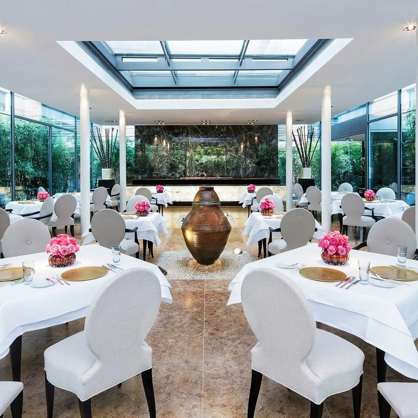 Elegant dining room at FACIL restaurant in Berlin, with natural light and stylish decor.
