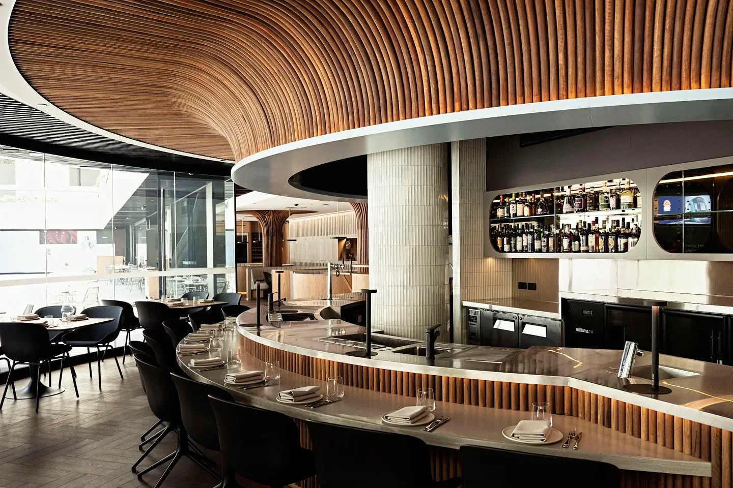 Stylish bar and dining area at Famelia restaurant in Sydney with unique wooden ceiling