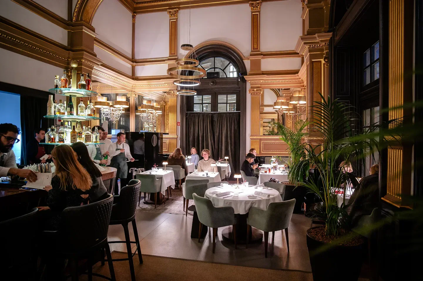 Elegant dining at Felix Kitchen & Bar in Budapest with bar and restaurant tables.