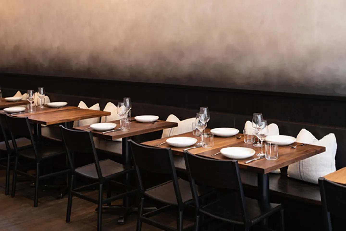 Interior dining area at Frances restaurant in San Francisco with tables set.