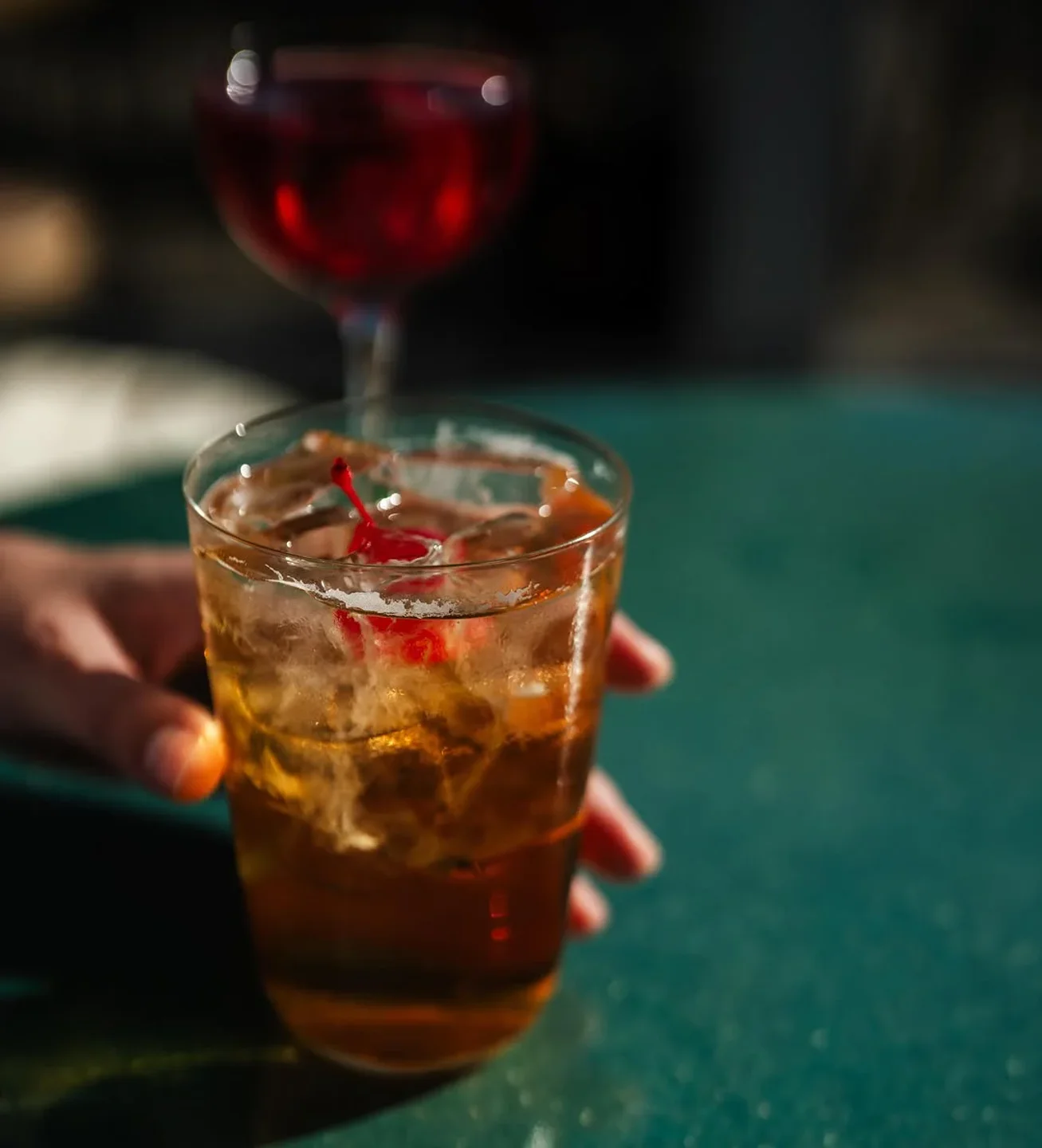 Freyja + Söder restaurant offers a classic cocktail with a cherry and ice, perfect for enjoying in the city.